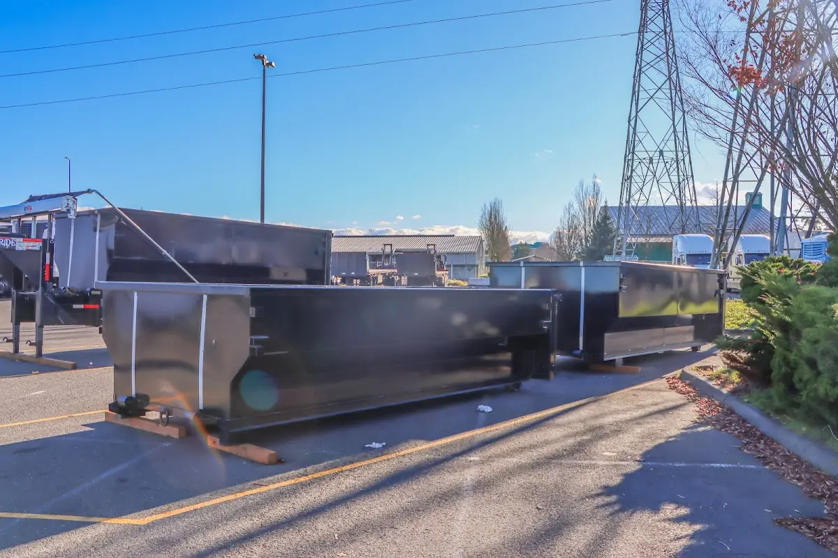 Roll-off dumpster ready for waste disposal at job site for 2 Yard Dumpster Rental in Bellefontaine Neighbors
